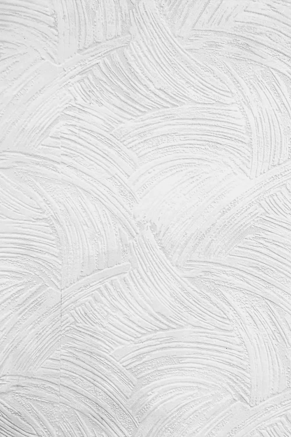 Witte wand met fijne structuur in het verfwerk